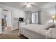 Cozy bedroom featuring a ceiling fan and natural light from the window at 49 Crooked Pine Rd, Port Orange, FL 32128