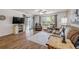 Spacious living room boasts lots of natural light and comfortable seating with outdoor access at 49 Crooked Pine Rd, Port Orange, FL 32128