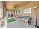 Comfortable screened porch with seating and a view through the sliding glass door at 49 Crooked Pine Rd, Port Orange, FL 32128