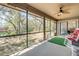 Spacious screened porch with views of the yard, trees, and pond at 49 Crooked Pine Rd, Port Orange, FL 32128