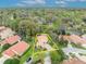 Charming home with lush landscaping and a paver driveway nestled among mature trees in a desirable neighborhood at 509 Osprey Ln, Winter Springs, FL 32708