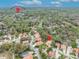 A location-aware aerial view showing nearby Highland Elementary School near lush, mature trees and tiled roof houses at 509 Osprey Ln, Winter Springs, FL 32708