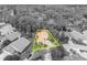 Aerial view in black and white shows the home with a yellow border, tile roof, and mature trees at 509 Osprey Ln, Winter Springs, FL 32708