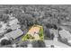 Black and white aerial view featuring home outlined in yellow with tile roof, and mature trees at 509 Osprey Ln, Winter Springs, FL 32708