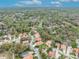 Expansive aerial view of homes in a verdant community, near Highlands Elementary and surrounded by lush greenery at 509 Osprey Ln, Winter Springs, FL 32708