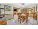 Elegant dining area featuring a round table set and view to living room with fireplace at 509 Osprey Ln, Winter Springs, FL 32708