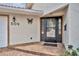 Inviting front entrance with decorative butterfly accent and brick-paved walkway at 509 Osprey Ln, Winter Springs, FL 32708