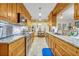Well-lit kitchen featuring wooden cabinetry, granite countertops, and stainless steel appliances at 509 Osprey Ln, Winter Springs, FL 32708
