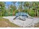 Outdoor playground offers two slides, swings, and climbing structures on a well-maintained sandy area at 509 Osprey Ln, Winter Springs, FL 32708