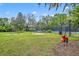 Community playground with swings, play structures, and ample green space for outdoor fun at 509 Osprey Ln, Winter Springs, FL 32708