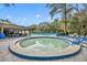 Community pool area with a large pool, kiddie pool, lounge chairs, and tables at 509 Osprey Ln, Winter Springs, FL 32708
