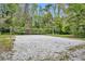 Outdoor sand volleyball court surrounded by trees and lush vegetation at 509 Osprey Ln, Winter Springs, FL 32708