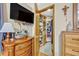 Spacious closet featuring custom shelving and storage with wooden dresser in foreground at 509 Osprey Ln, Winter Springs, FL 32708