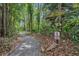 Tree-lined trail for residents only offers a scenic route through lush foliage and greenery at 509 Osprey Ln, Winter Springs, FL 32708