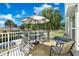 Enjoy waterfront views from this outdoor balcony with patio seating and palm trees at 521 Marina Point Dr # 521, Daytona Beach, FL 32114