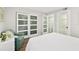 Bright bedroom with a closet, accent chair, and neutral tones creating a comfortable and stylish retreat at 521 Marina Point Dr # 521, Daytona Beach, FL 32114