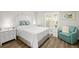Cozy bedroom with a queen bed, white furniture, and ample natural light creating a relaxing atmosphere at 521 Marina Point Dr # 521, Daytona Beach, FL 32114