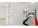 Hallway view leading to an open living space showcasing modern design and an inviting atmosphere at 521 Marina Point Dr # 521, Daytona Beach, FL 32114