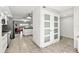 Hallway that leads into a bright and modern kitchen and living space at 521 Marina Point Dr # 521, Daytona Beach, FL 32114