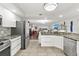 Open concept floor plan with kitchen opening to the living and dining area at 521 Marina Point Dr # 521, Daytona Beach, FL 32114