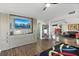 Modern room with a murphy bed with a view of a boat filled harbor, and a decorative mirror at 521 Marina Point Dr # 521, Daytona Beach, FL 32114