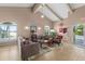 Inviting lobby space features vaulted ceilings, comfortable seating, and serene views from the arched windows at 521 Marina Point Dr # 521, Daytona Beach, FL 32114