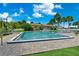 Community pool with plenty of lounge chairs, ready for relaxing and soaking up the sun at 521 Marina Point Dr # 521, Daytona Beach, FL 32114