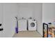 Laundry area with modern washer and dryer, providing convenience and efficiency for household chores at 605 Anderson Dr, Deltona, FL 32725