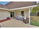 Covered patio with comfortable seating, providing an ideal space for relaxation and outdoor entertainment at 605 Anderson Dr, Deltona, FL 32725