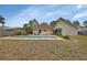 Residential backyard with swimming pool and plenty of space for entertaining and enjoying outdoor living at 605 Anderson Dr, Deltona, FL 32725
