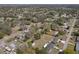 Neighborhood aerial view showing the property among mature trees, residential streets, and local community at 61 West Highbanks, Debary, FL 32713