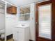 A functional basement bathroom with a toilet, sink vanity, and an exterior access door at 61 West Highbanks, Debary, FL 32713