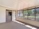 Enclosed patio with screen windows and access to the backyard at 61 West Highbanks, Debary, FL 32713