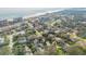 Picturesque coastal community featuring a mix of residential homes near a beach and ocean at 65 Calumet Ave, Ponce Inlet, FL 32127