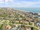 Scenic aerial view of a neighborhood with a mix of homes close to the beach and ocean at 65 Calumet Ave, Ponce Inlet, FL 32127