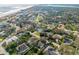 Beautiful aerial view of a coastal neighborhood featuring single-Gathering homes and access to the beach at 65 Calumet Ave, Ponce Inlet, FL 32127