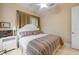 A bedroom with a bed, a window, tile flooring, and a ceiling fan at 65 Calumet Ave, Ponce Inlet, FL 32127