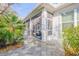 Stylish home exterior with a screened-in patio and a landscaped walkway, showcasing curb appeal at 65 Calumet Ave, Ponce Inlet, FL 32127