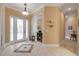 Elegant home foyer with decorative front door and chandelier, showcasing the home's inviting entryway and design at 65 Calumet Ave, Ponce Inlet, FL 32127