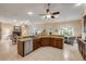 Expansive kitchen area with tile flooring, stainless steel dishwasher, and an open layout into the living areas at 65 Calumet Ave, Ponce Inlet, FL 32127