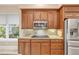 Updated kitchen features granite countertops and stainless steel appliances with ample cabinet space at 65 Calumet Ave, Ponce Inlet, FL 32127