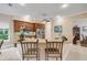 Well-equipped kitchen with granite counters, stainless steel appliances, and a breakfast bar with comfortable seating at 65 Calumet Ave, Ponce Inlet, FL 32127