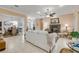 Inviting living room with fireplace, neutral palette, and views into other rooms at 65 Calumet Ave, Ponce Inlet, FL 32127