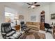 An office with tile flooring, leather chairs, a couch, a desk, and a bookshelf at 65 Calumet Ave, Ponce Inlet, FL 32127