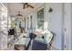 Spacious screened patio featuring comfortable lounge furniture and a tranquil garden view at 65 Calumet Ave, Ponce Inlet, FL 32127