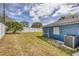 The backyard features a well-maintained lawn, privacy fence, and easy access to the home's exterior at 711 Hiview Cir, Port Orange, FL 32127