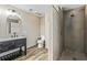 Updated bathroom boasts a sleek vanity, modern fixtures, and a tiled walk-in shower at 711 Hiview Cir, Port Orange, FL 32127