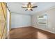 Bedroom boasts sleek floors, modern ceiling fan and a sliding barn door feature at 711 Hiview Cir, Port Orange, FL 32127