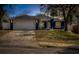 Charming home exterior featuring a well-manicured lawn, covered porch, and attached two-car garage at 711 Hiview Cir, Port Orange, FL 32127