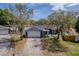 This home features a spacious driveway, a two-car garage, and a charming front porch with lots of curb appeal at 711 Hiview Cir, Port Orange, FL 32127